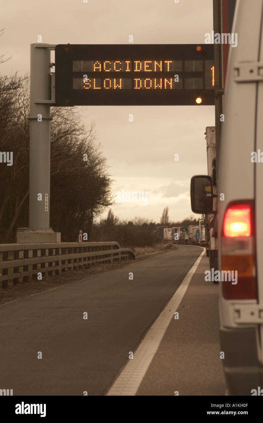 Road Traffic Accident Delays Again - Road Sign Stock Photo