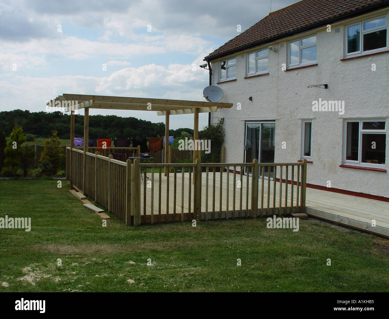Timber garden decking with balustrades and pergola Stock Photo
