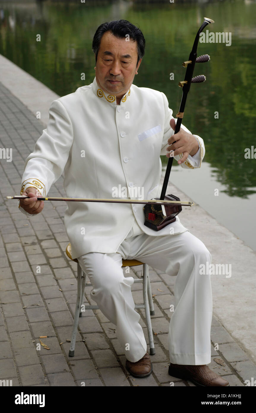 Beijing resident plays Chinese folk musical instrument 2006 Stock Photo