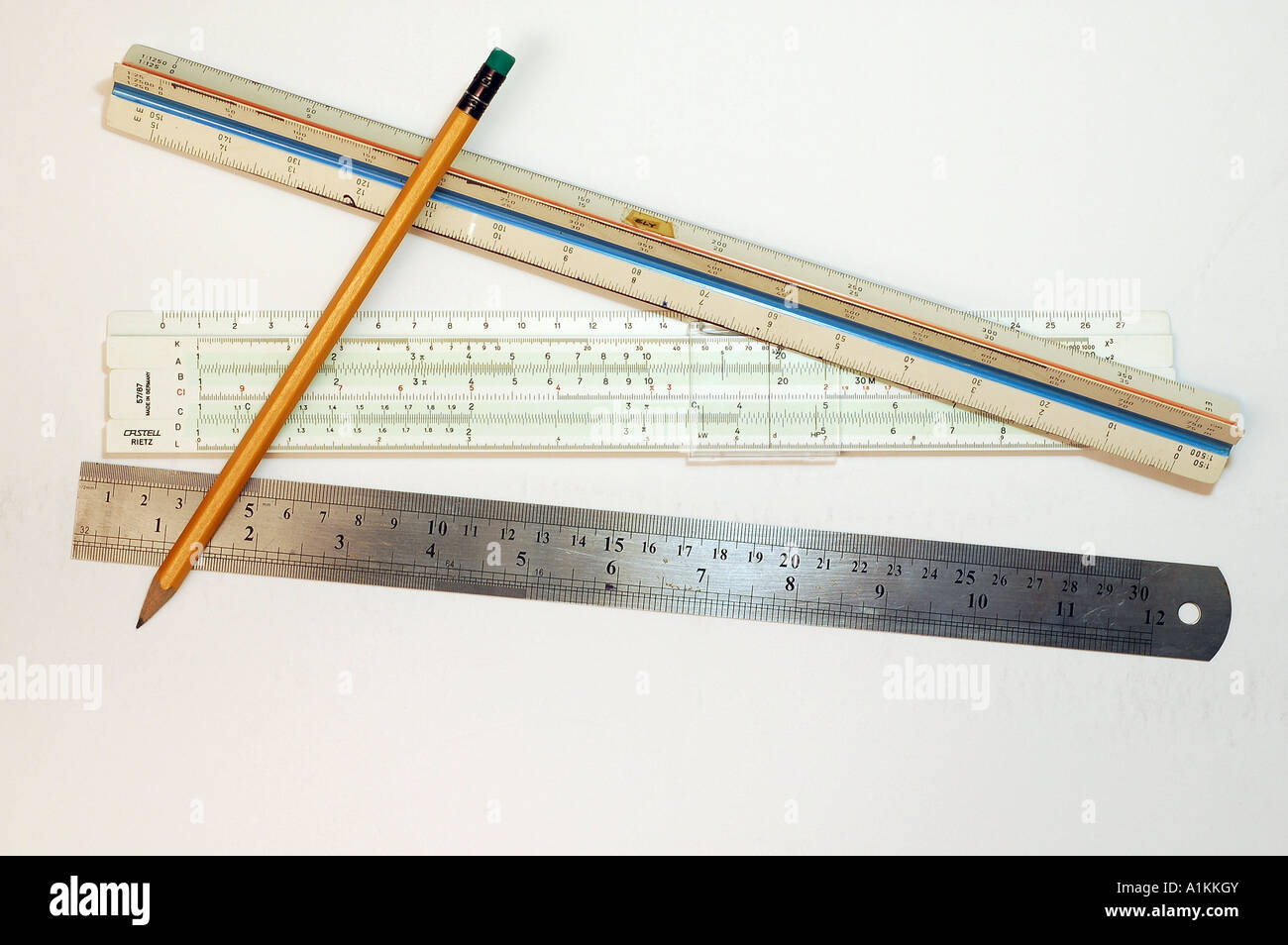 3 types of rulers regular slid and scale with a pencil used for planning and design work Stock Photo