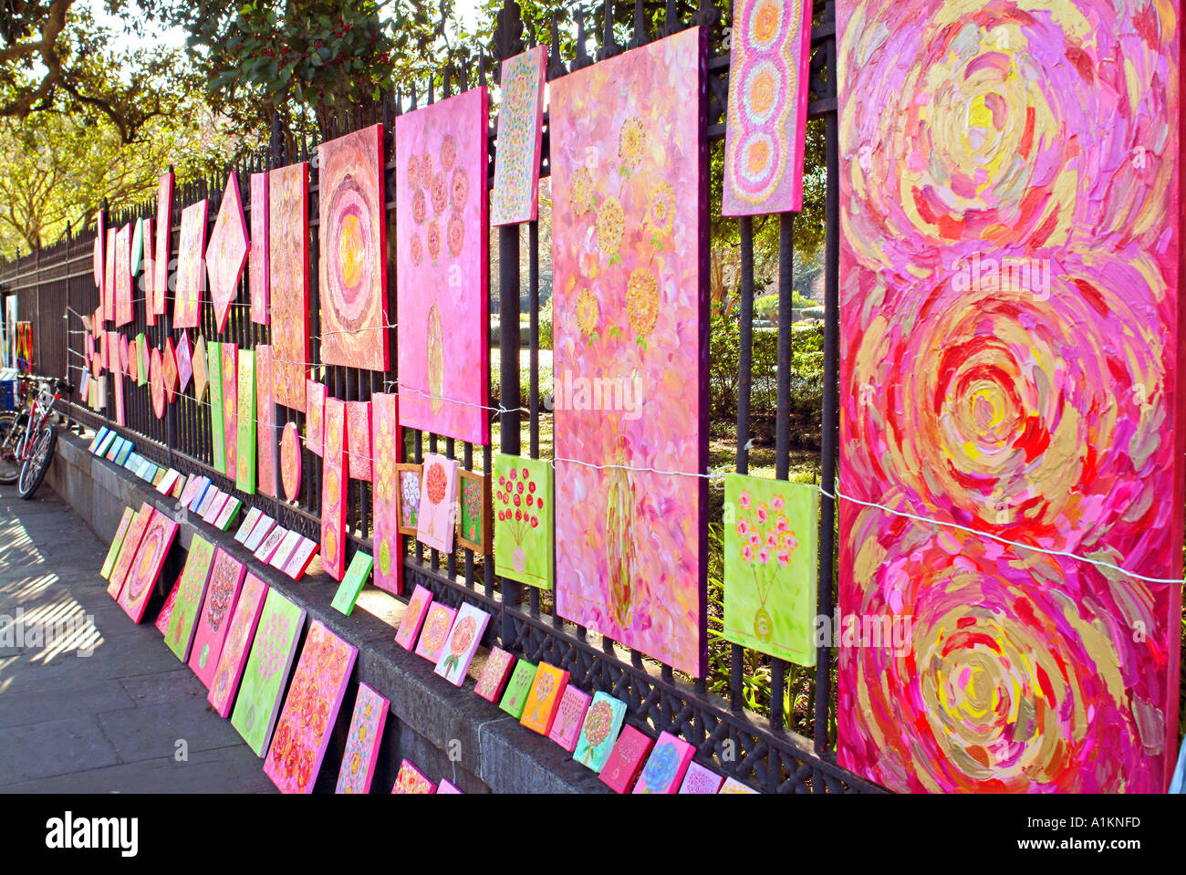 Artwork hanging on fence in Jackson Square in New Orleans Louisiana Stock Photo