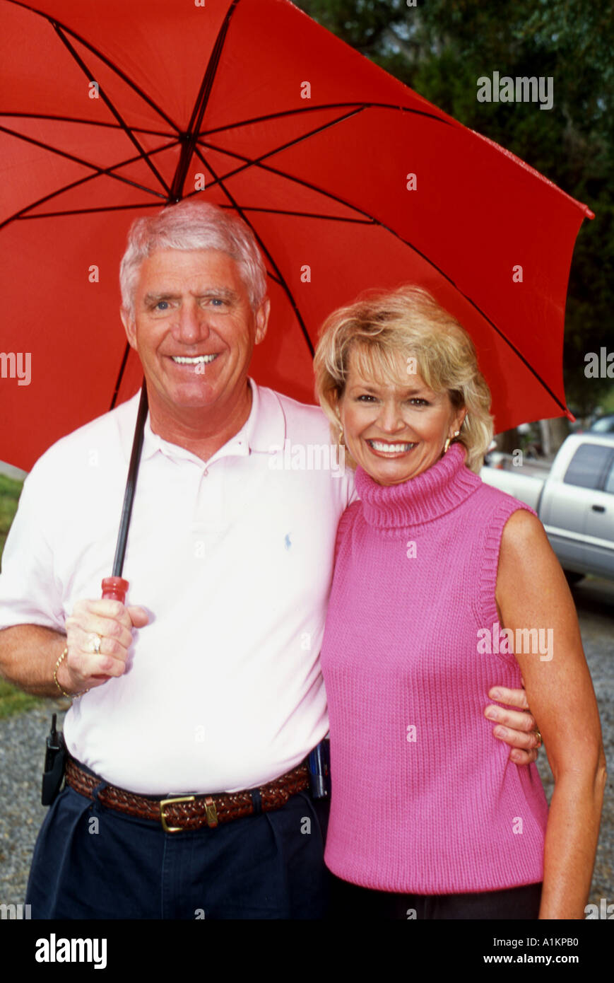 Loving couple in rain umbrella hi-res stock photography and images - Alamy