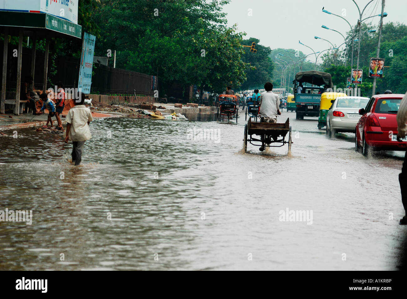 Delhi India street flooded due to monsoon rains Stock Photo - Alamy