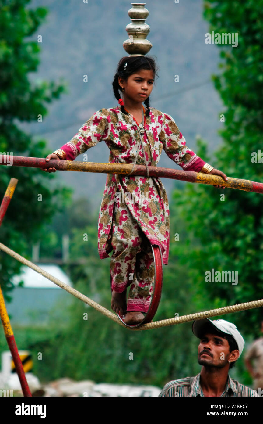 India Kullu District Himachal Pradesh Northern India A travelling circus a young girl on a tight rope Stock Photo