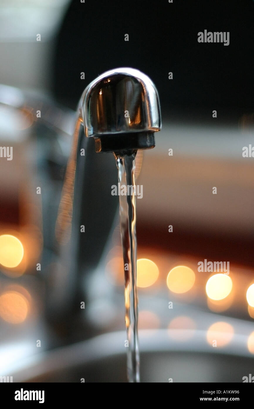 Tap running water into a sink Draught waste water run running tap drink