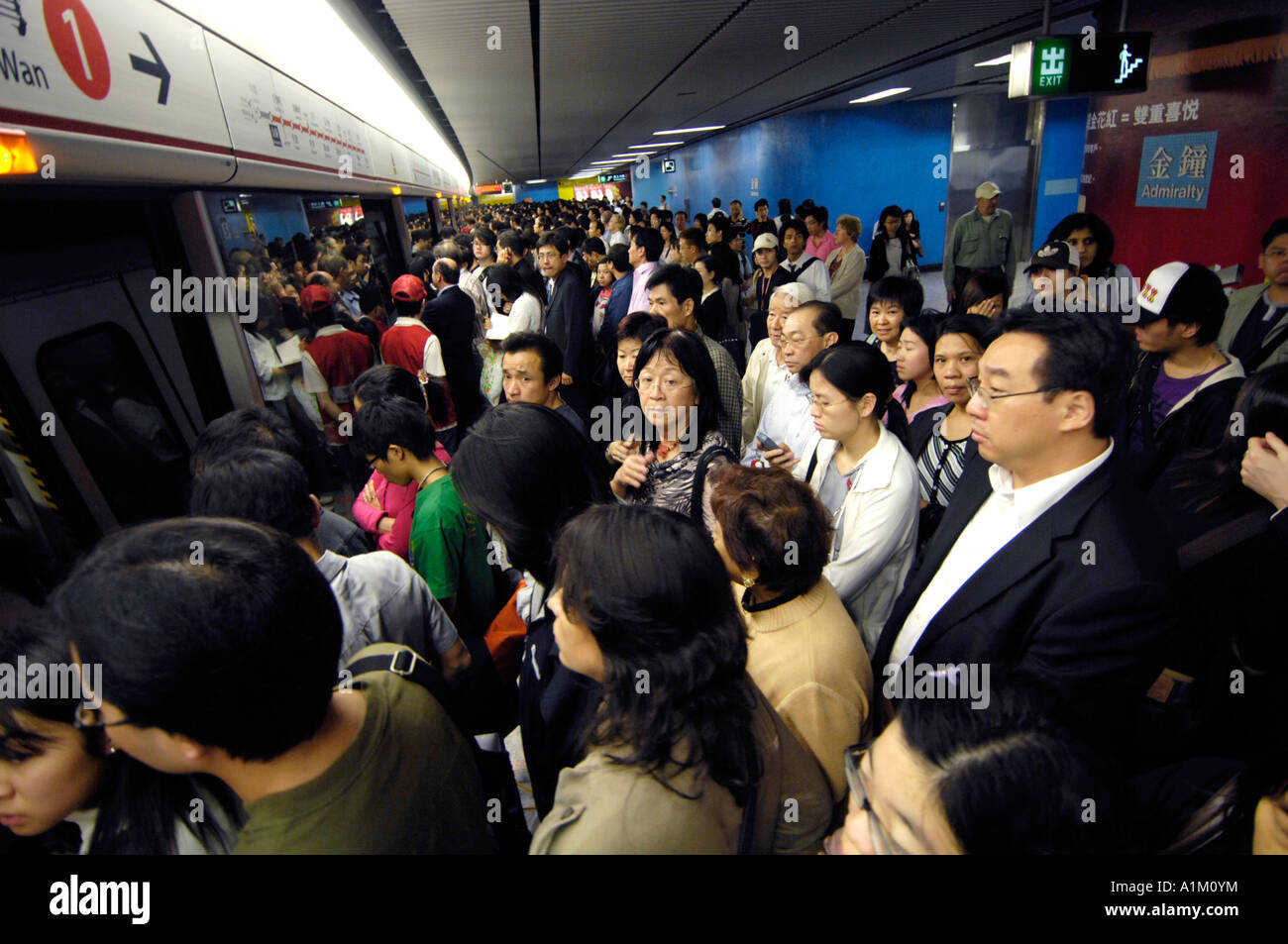 MAN WITH MEGAPHONE PUSH COMMUTERS INTO CROWDED TRAIN SO DOORS WILL CLOSE  RUSH HOUR AT PEOPLE S SQUARE SHANGHAI CHINA Stock Photo - Alamy