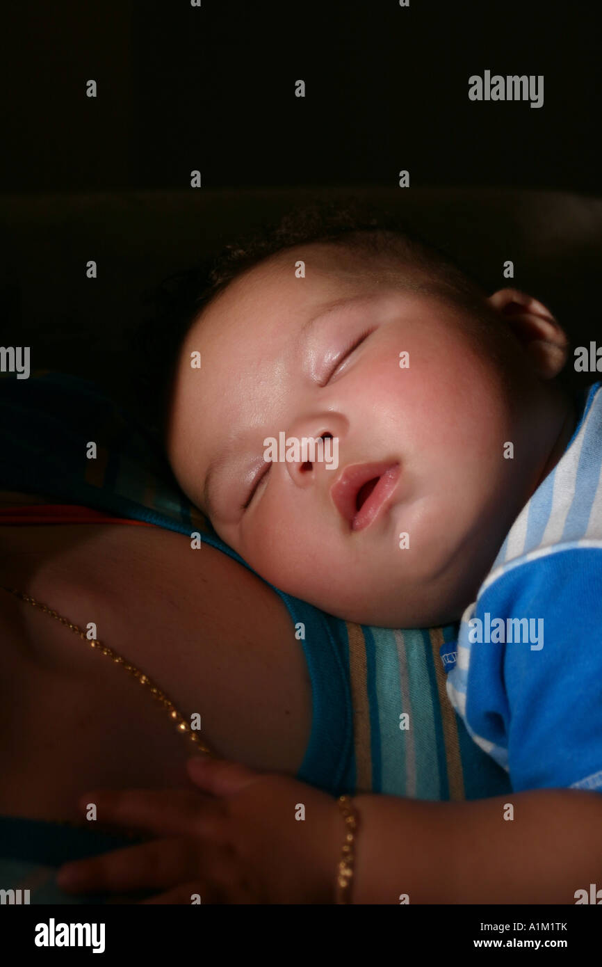 Baby sleeping on mom chest hi-res stock photography and images - Alamy