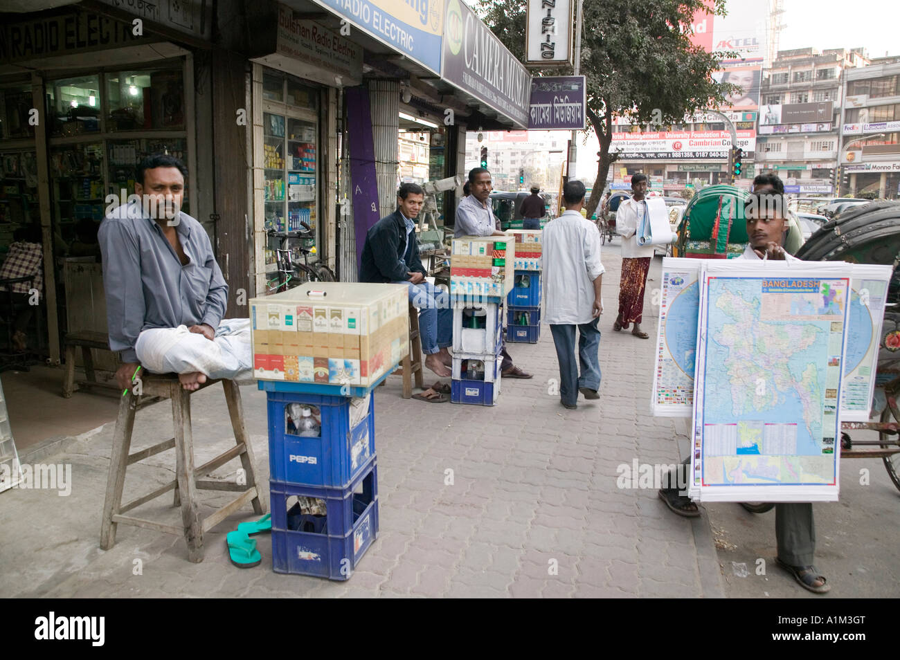 Vendors selling cigarettes and maps in Gulsha Dhaka Bangladesh Stock