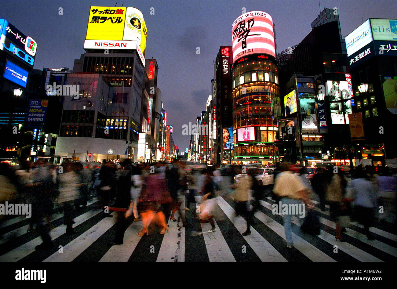 pedestrians crossing the road at an intersection in Shinjuku in Tokyo Tokio Japan Asia Stock Photo