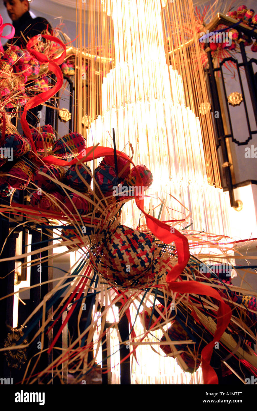 Christmas Decorations On A Spiral Staircase With A Chandelier