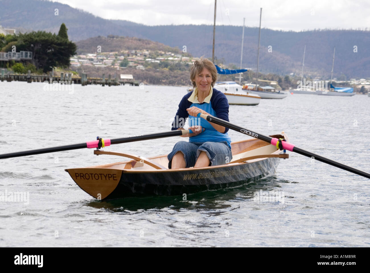Rowing in a sleek modern designed rowing skiff Stock Photo