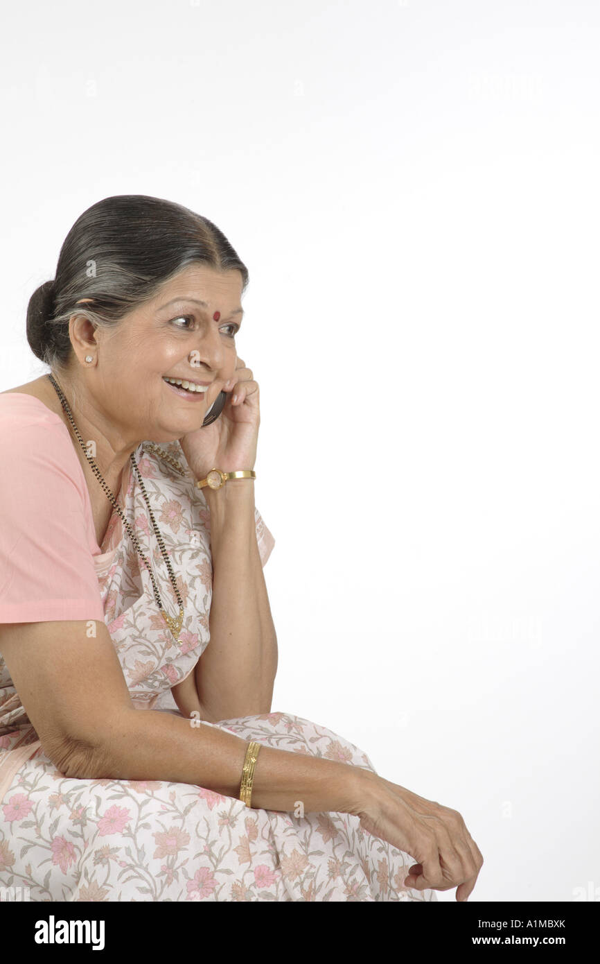 Senior indian woman wearing saree hi-res stock photography and images ...