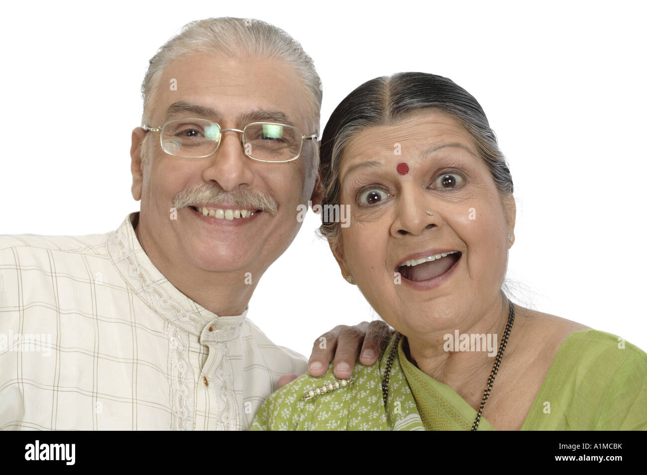 Happy Indian senior citizen couple on white background Stock Photo