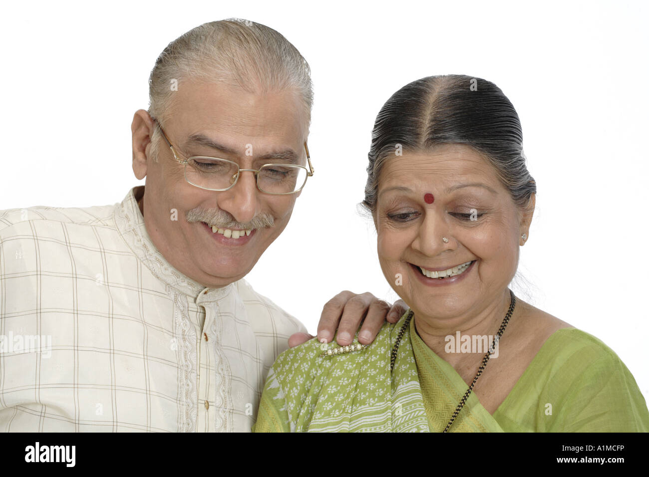 Indian senior citizen couple on white background Stock Photo