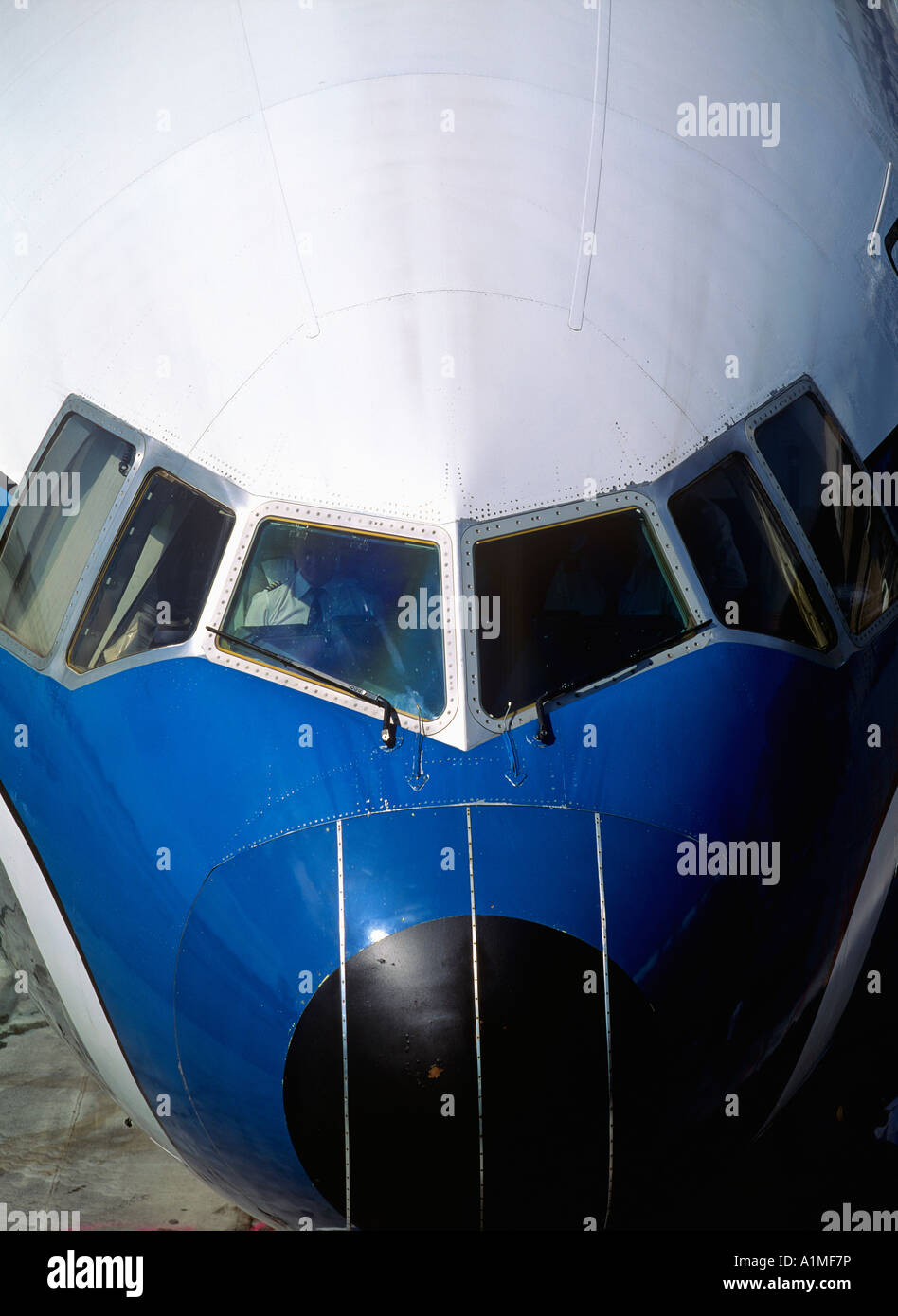 pilot at ready for departure briefing in aircraft at fingerdock Stock