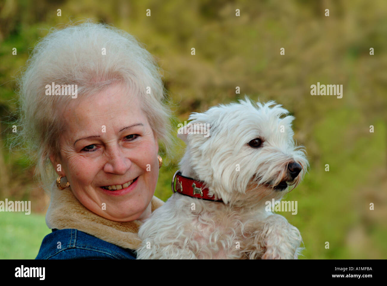 Portrait of a woman with her dog Stock Photo - Alamy