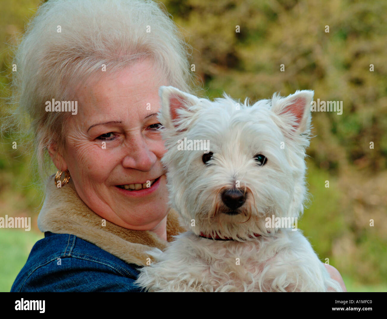 Portrait of a woman with her dog Stock Photo - Alamy