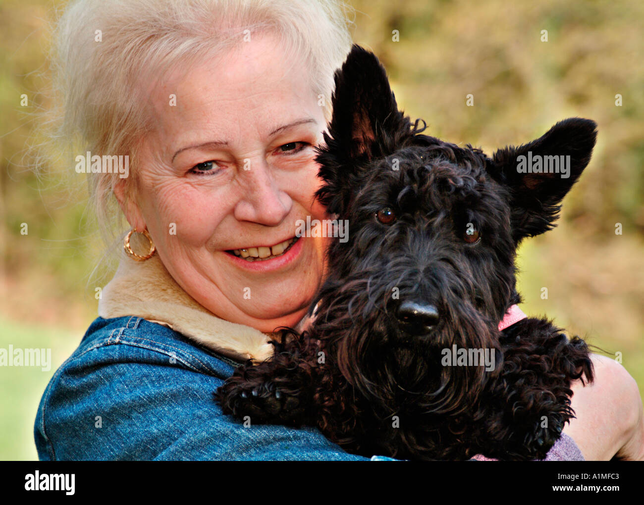 Portrait of a woman with her dog Stock Photo - Alamy