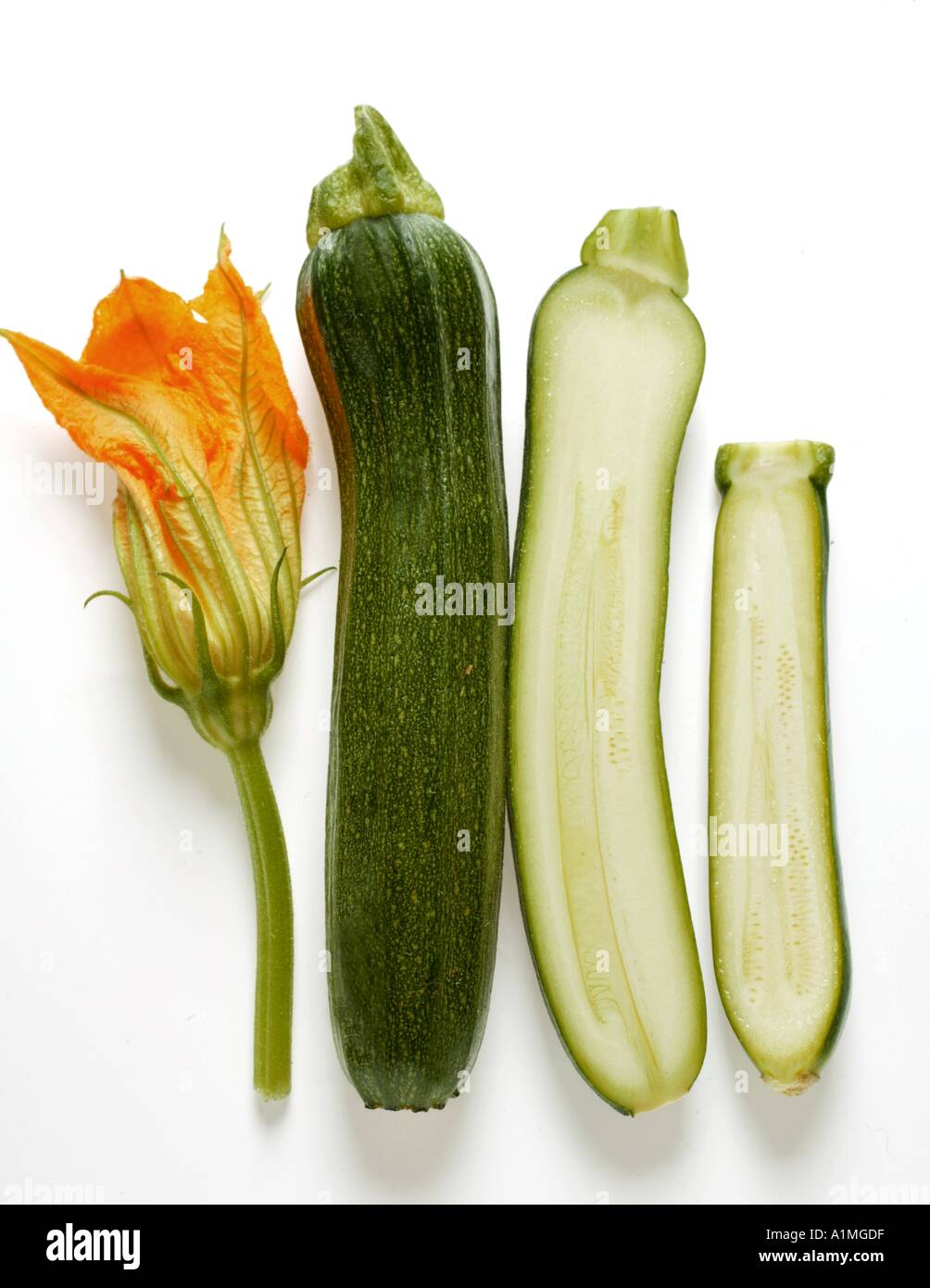 Courgette flower whole and half courgettes Stock Photo Alamy