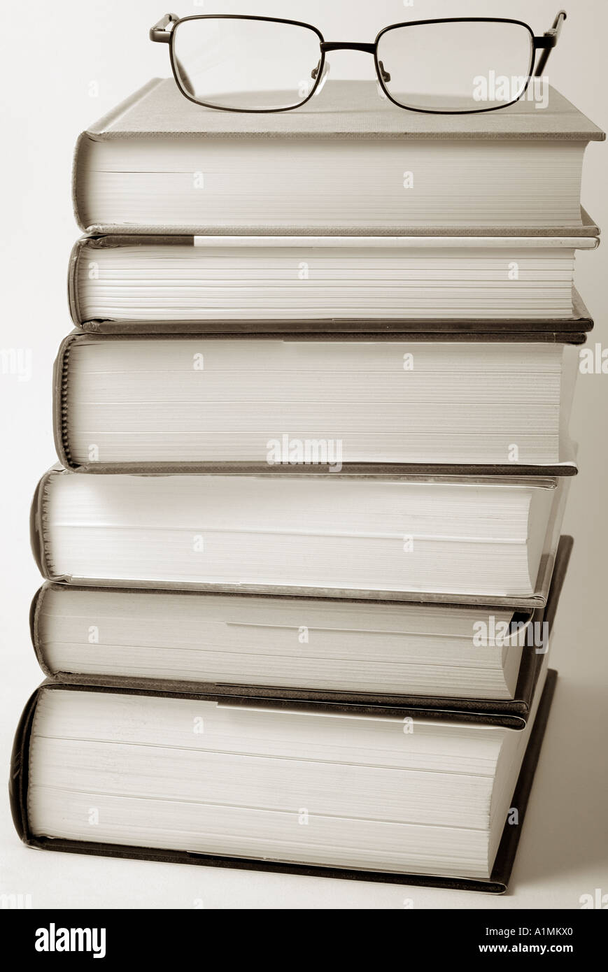 Stack of Books with a Pair of Spectacles on Top Stock Photo