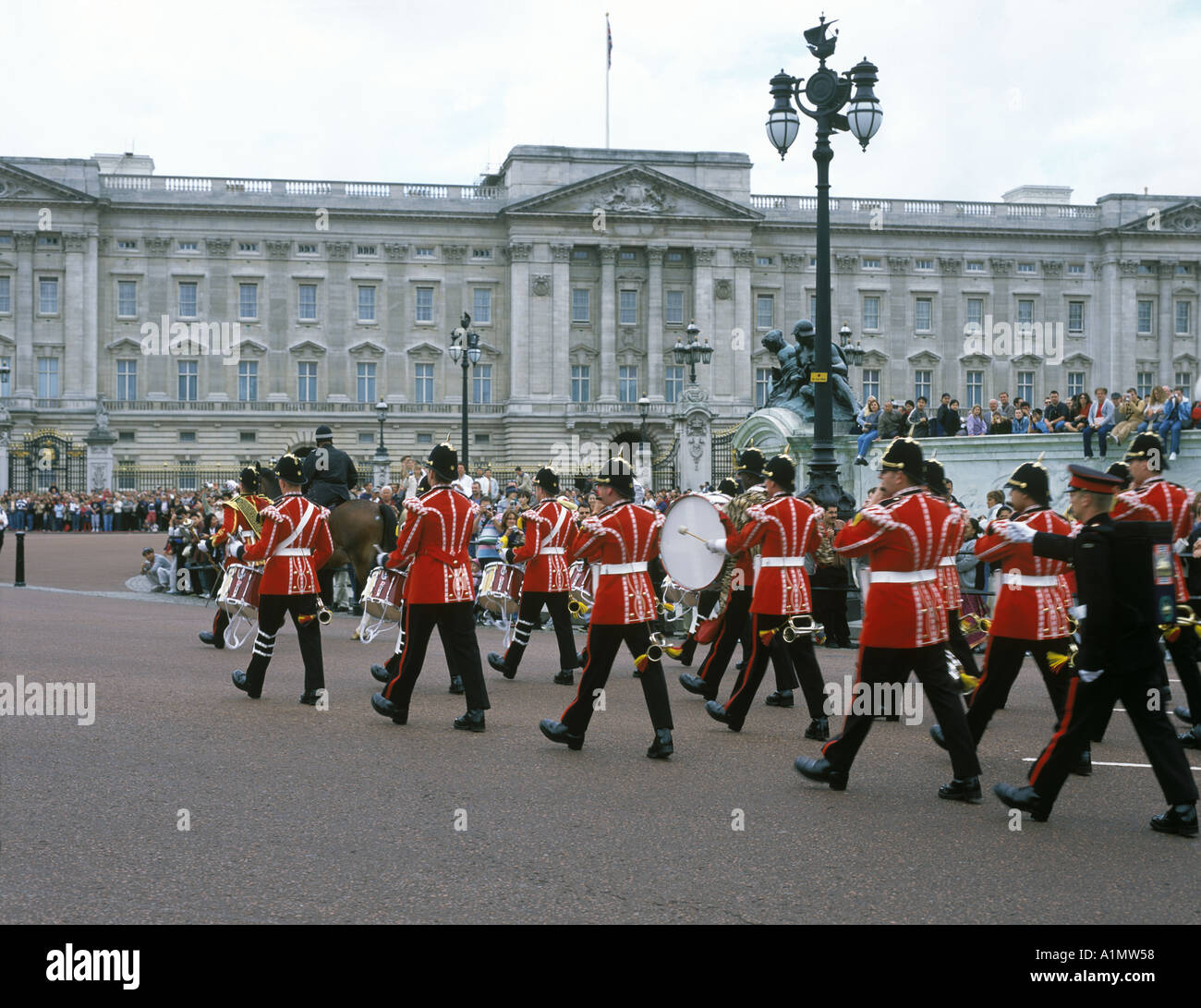 A marching band in front of Buchingham Palace in London England Stock