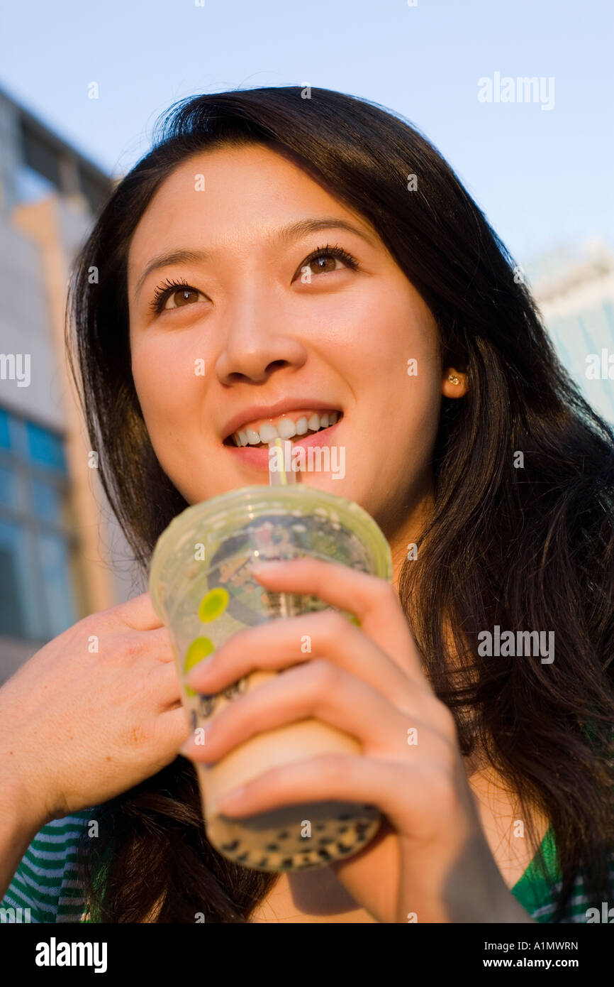 Yong woman drinking bubble tea Stock Photo Alamy