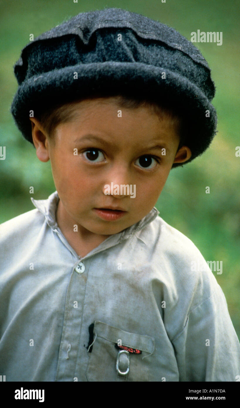 shy Pakistani boy in a traditional woollen Chitrali hat Stock Photo
