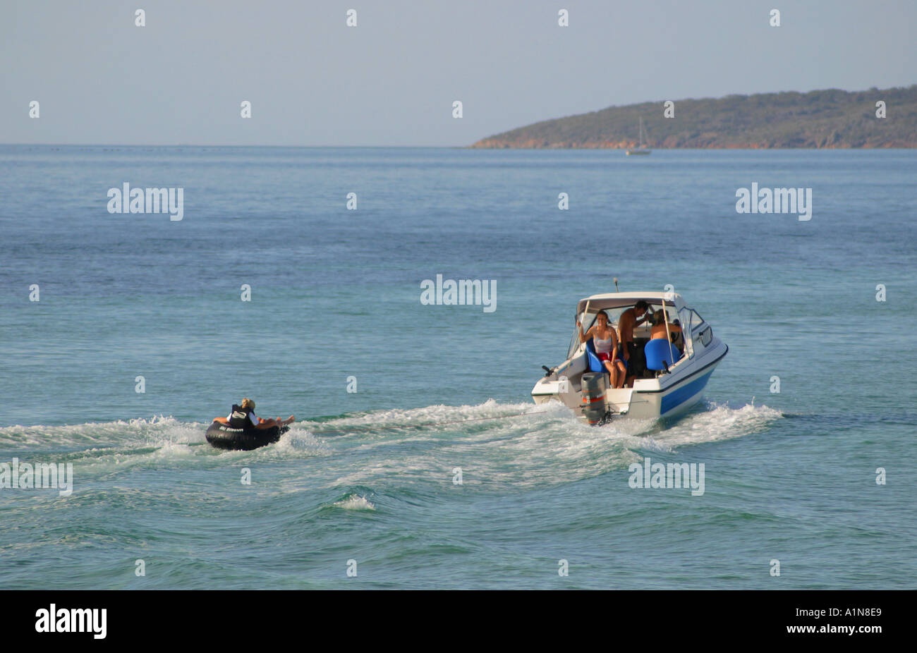 Towing tube behind a power boat Stock Photo Alamy