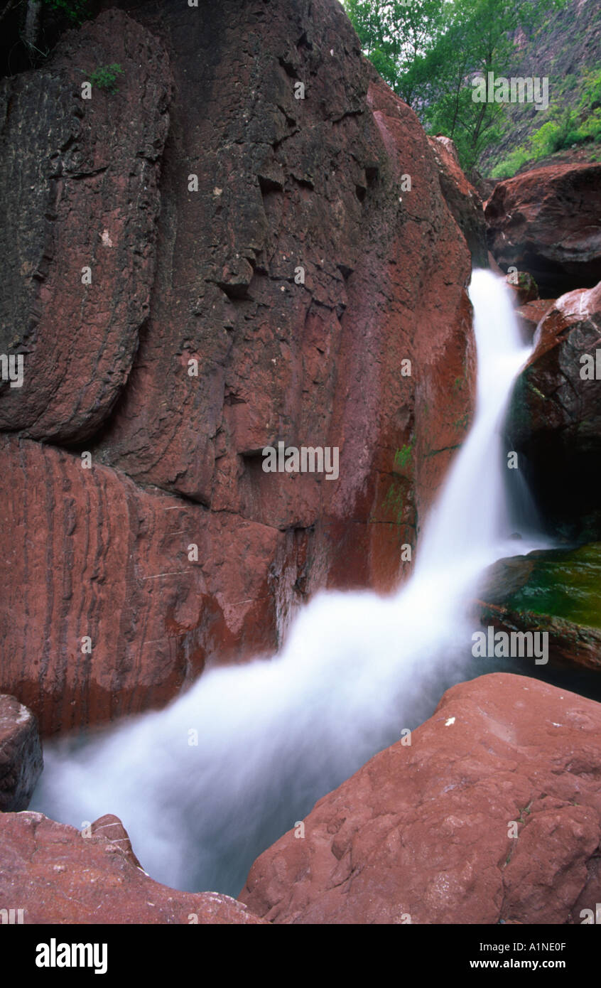 Waterfall Falling Down Red Rocks In Provence France Stock Photo