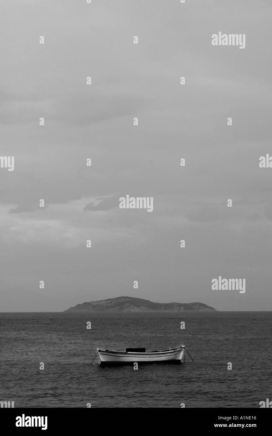 Solitary dinghy on mooring Skiathos Greece Stock Photo