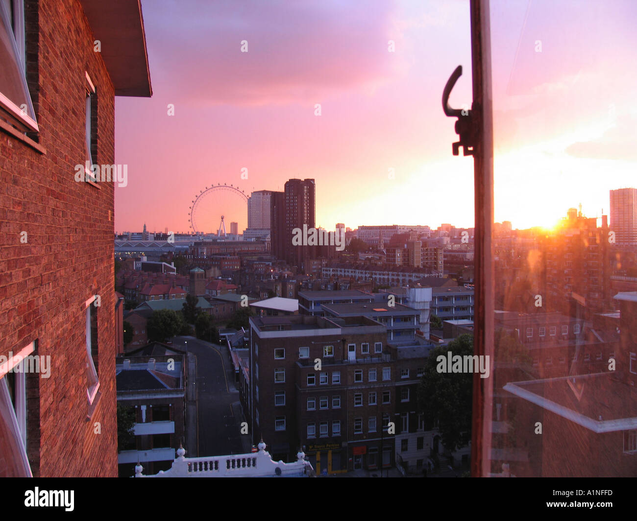 Sunset from the window of a council tower block London England Britain UK Stock Photo