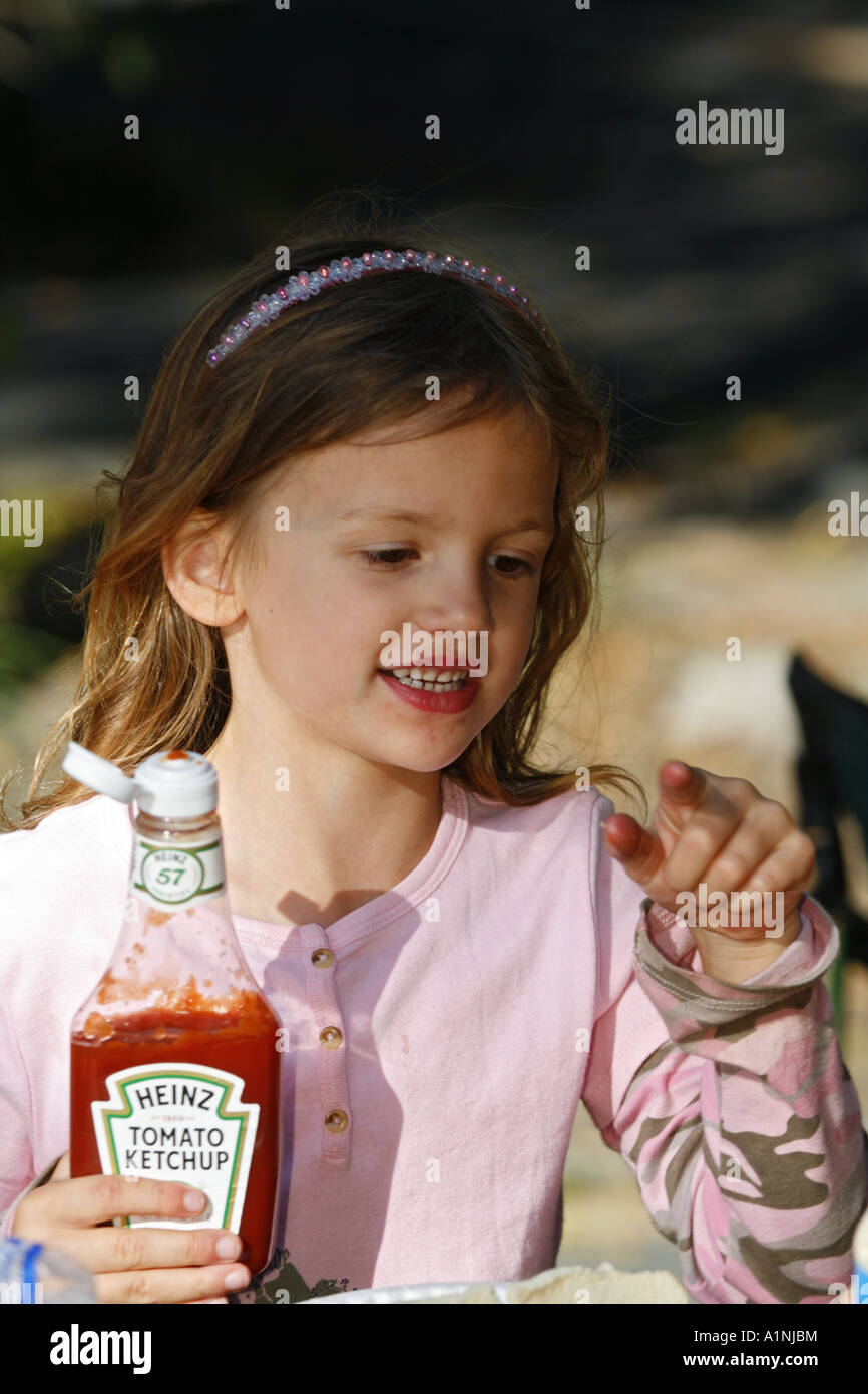 Girl putting ketchup hires stock photography and images Alamy