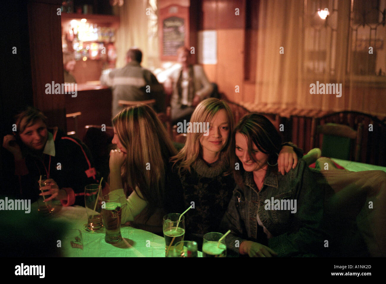 Young girls drinking in a bar in the town of Chelm Chelm is the nearest town to Polands border with the Ukraine Stock Photo