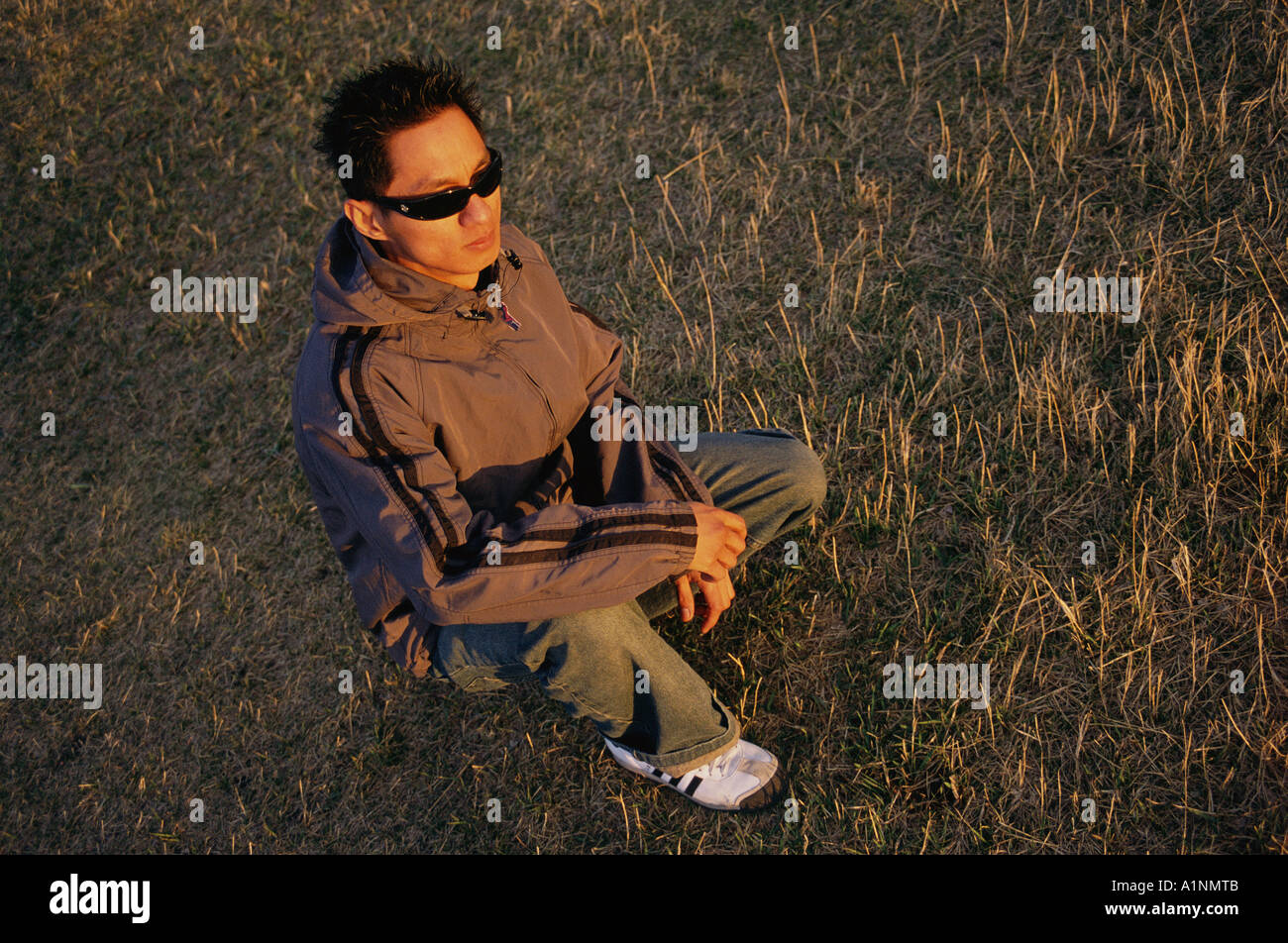 Kneeling young man wearing hi-res stock photography and images - Alamy