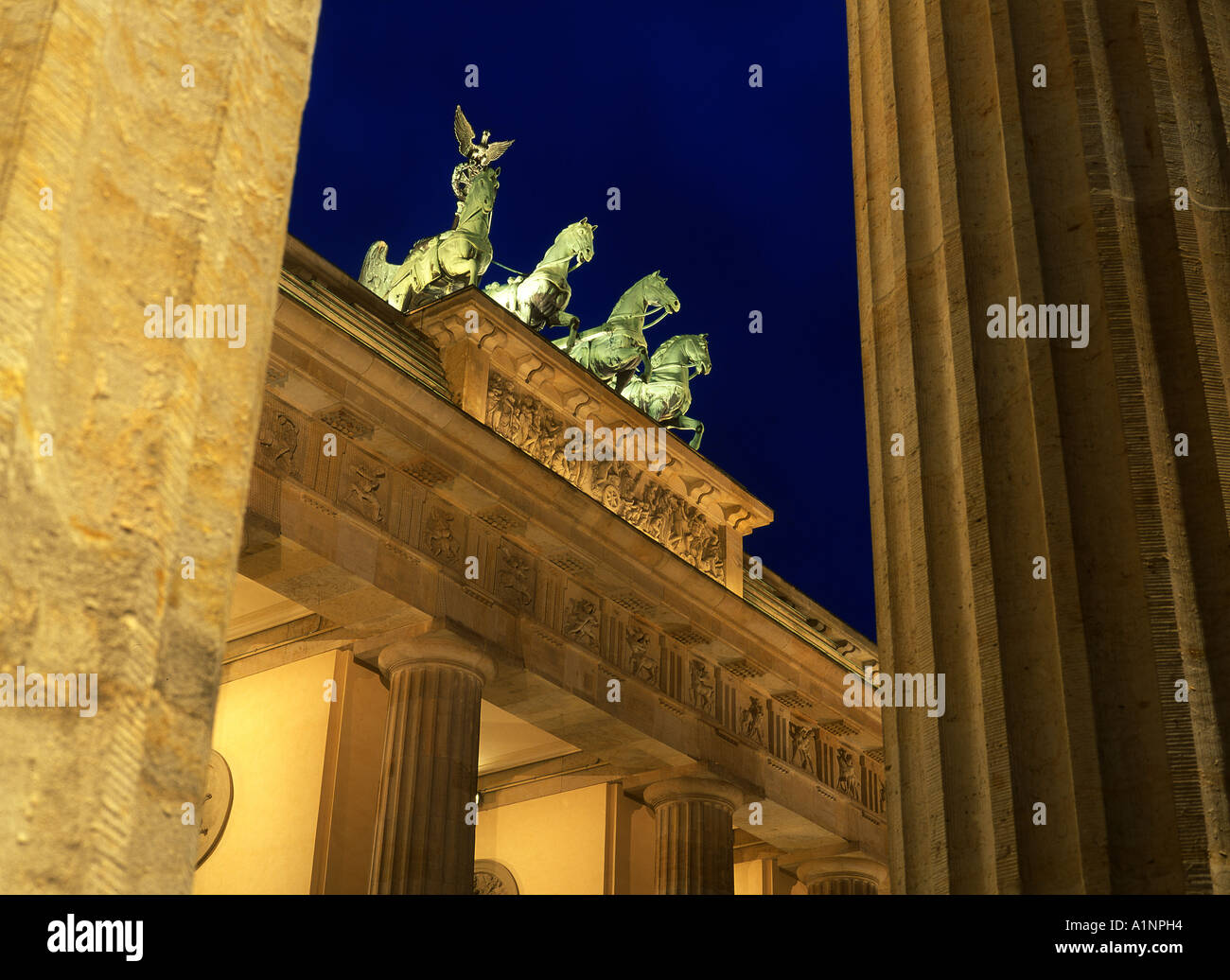 Brandenburg Gate Brandenburger Tor Night view through side pillars including Quadriga Mitte Berlin Brandenburg Germany Stock Photo