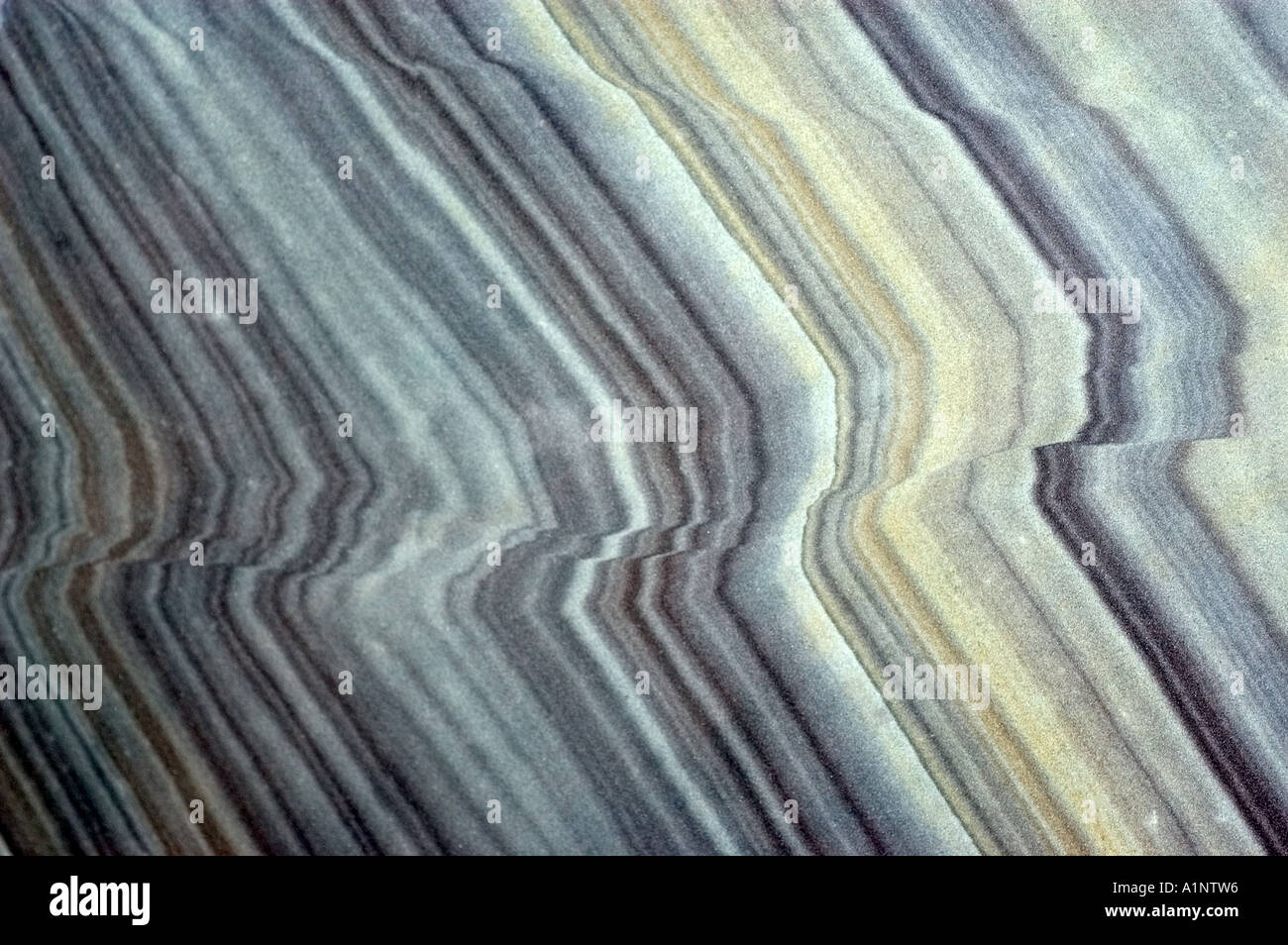 Reverse faults showing drag in sandstone Stock Photo