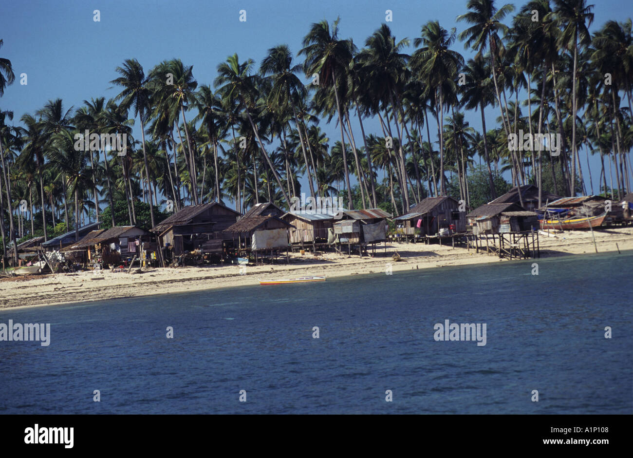 Badjao Badjau or Tau Laut sea gypsies settled Pulau Mabul Sabah Malaysia Borneo In Palm Trees Stock Photo