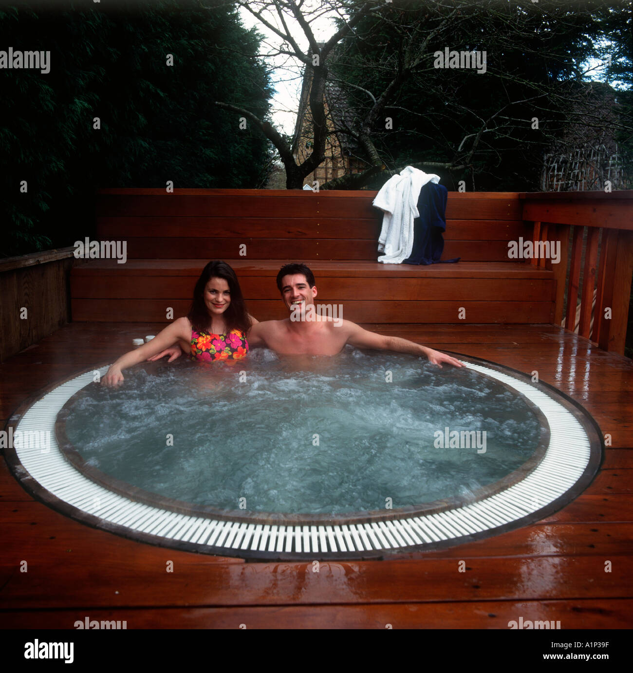 Young couple in hot tub Stock Photo