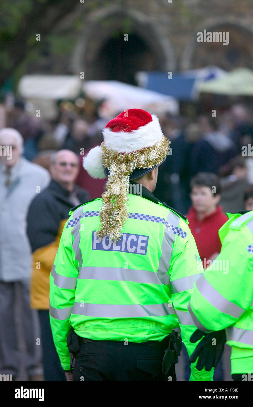 policemen patrolling the Lincoln Christmas Fair, Lincolnshire, UK Stock