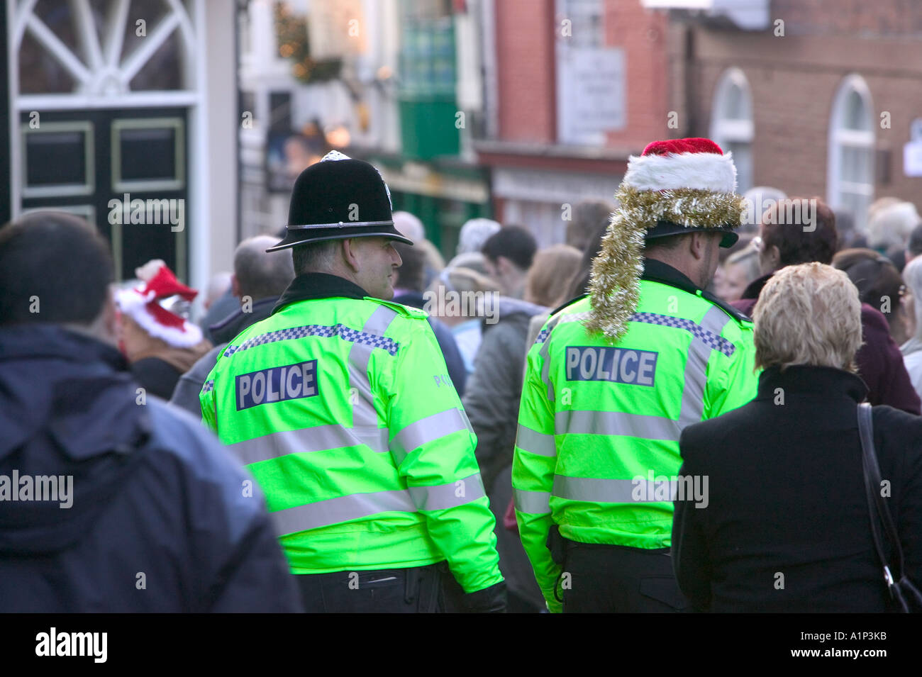 policemen patrolling the Lincoln Christmas Fair, Lincolnshire, UK Stock