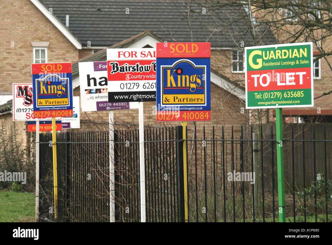 Harlow Essex estate agents letting agents and mortgage service providers advertising boards close to residential properties Stock Photo
