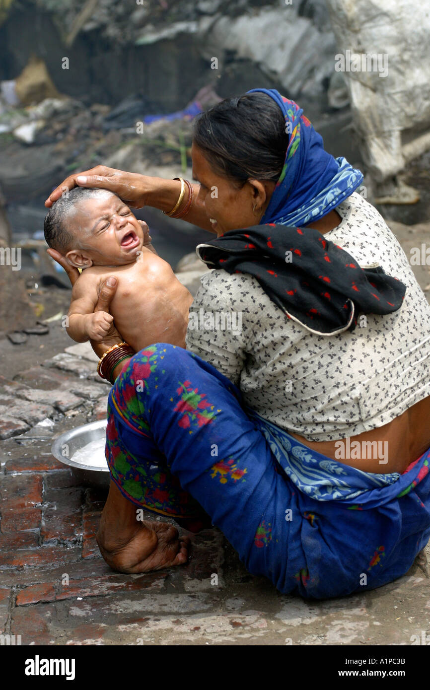 Indian mother baby in slum hi-res stock photography and images - Alamy
