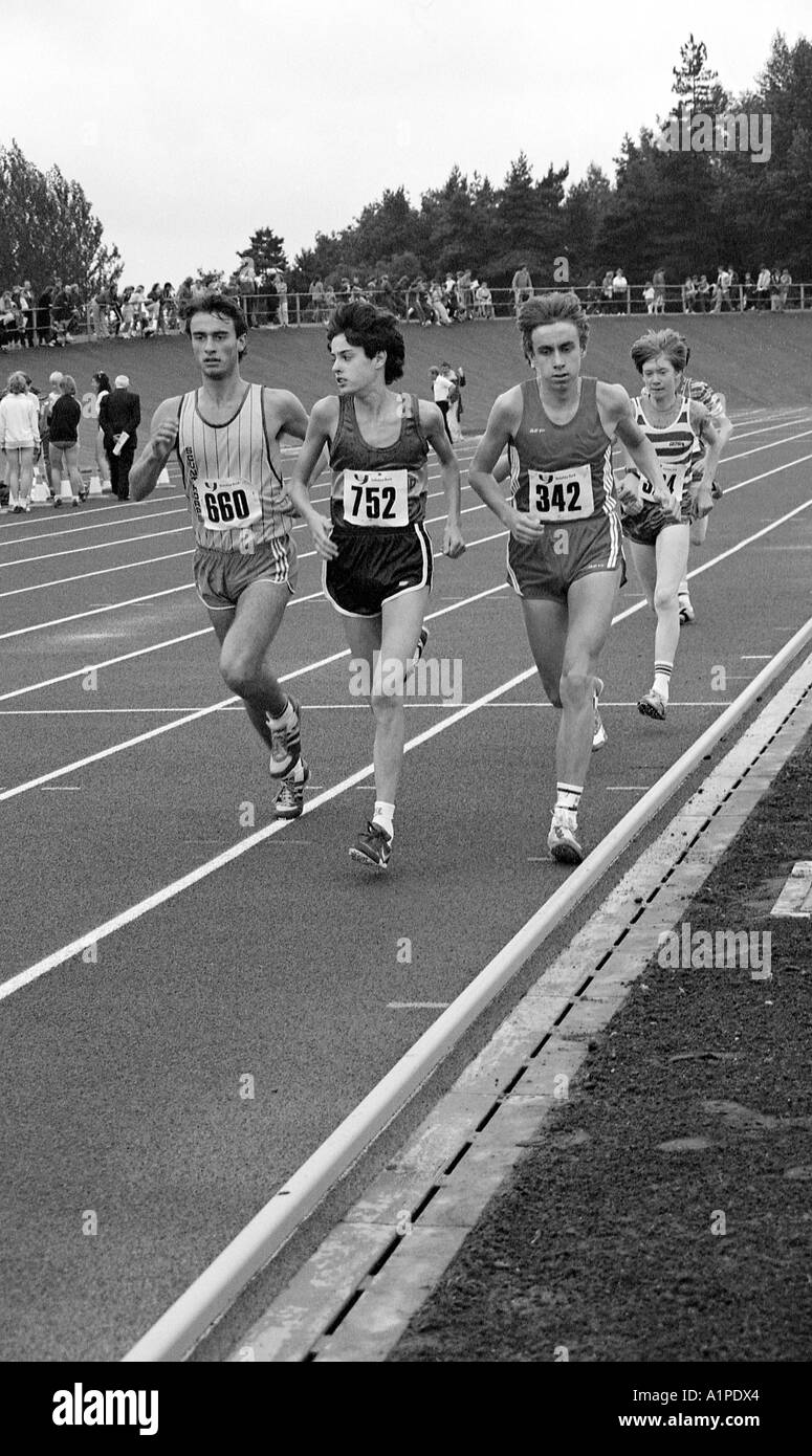 Group of club athletes using new tartan track at athletics stadium