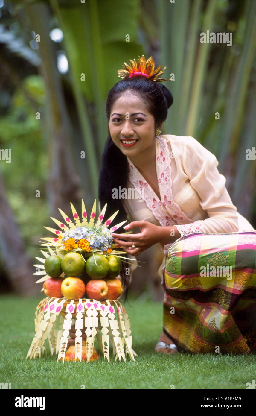 Indonesia, Balinese Girl With Fruit Stock Photo - Alamy