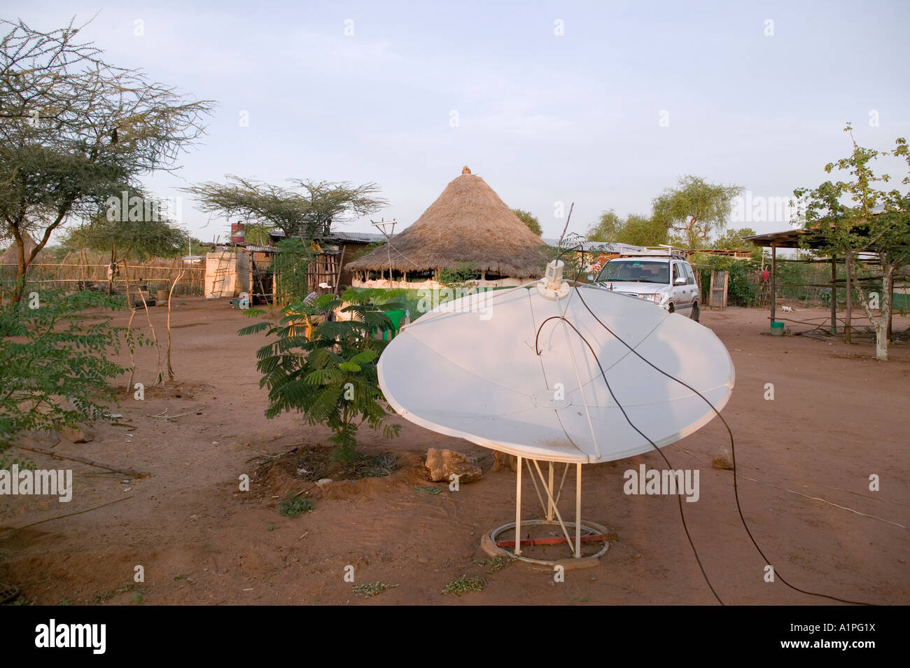 Satellite dish in restaurant courtyard in Turmi Ethiopia allows customers to watch satellite tv Stock Photo