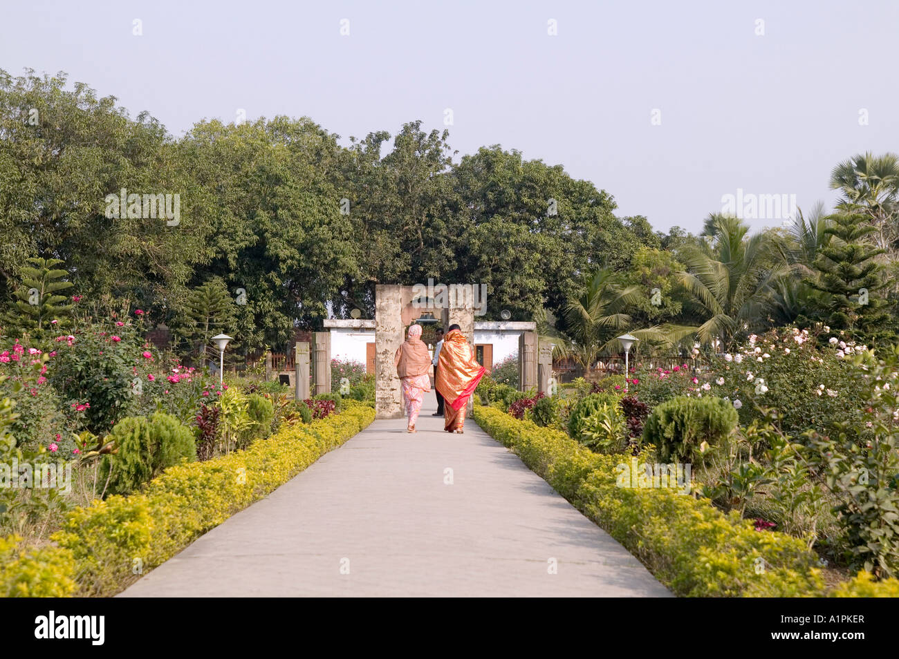 Women walking in the gardens at the Mahasthangar ruins near Bogra Bangladesh Stock Photo