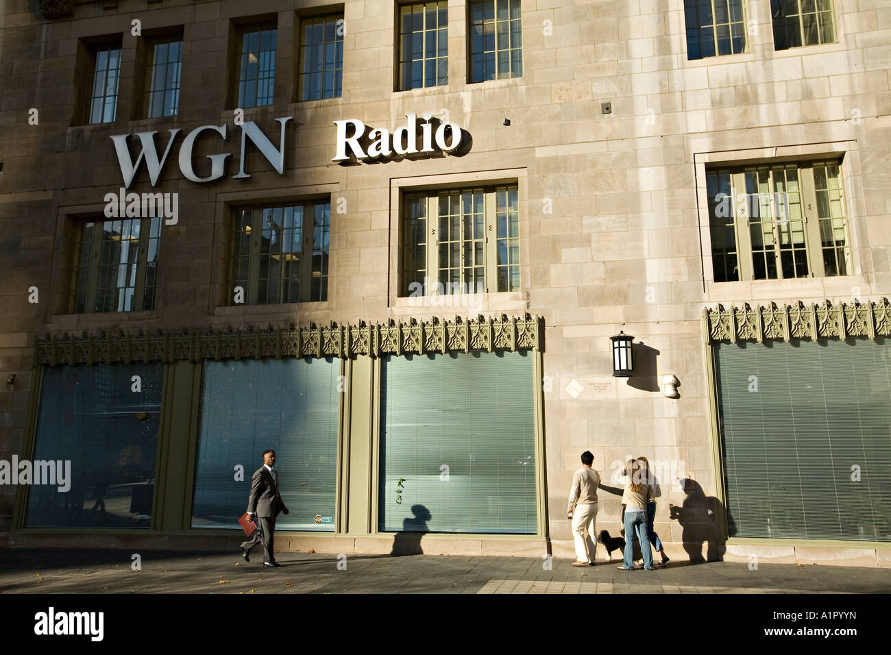 ILLINOIS Chicago People look at artifacts embedded in building WGN