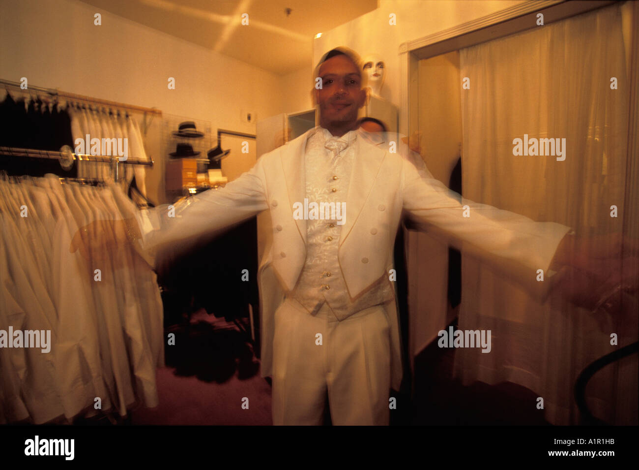 A customer at A Little White Wedding Chapel in  Las Vegas Nevada USA tries on a tuxedo for his  wedding Stock Photo