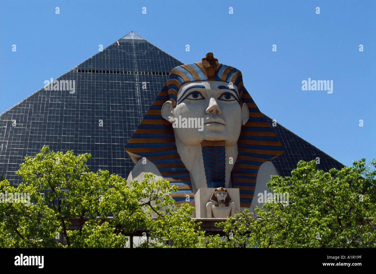 A Sphinx and Egyptian statue in front of the pyramid of Luxor Hotel