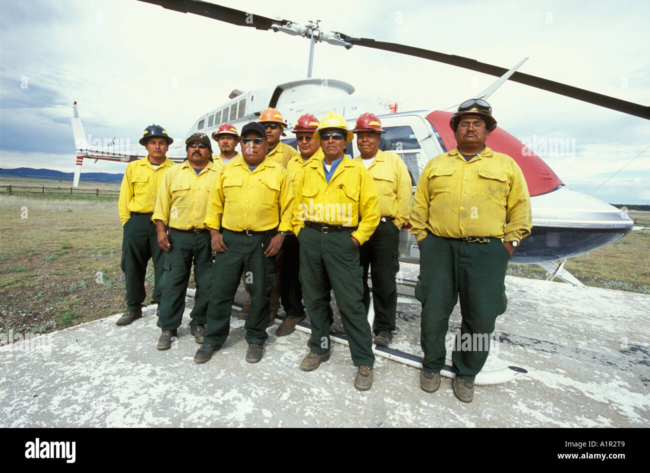 Apache firefighters in front of their helicopter on the San Carlos